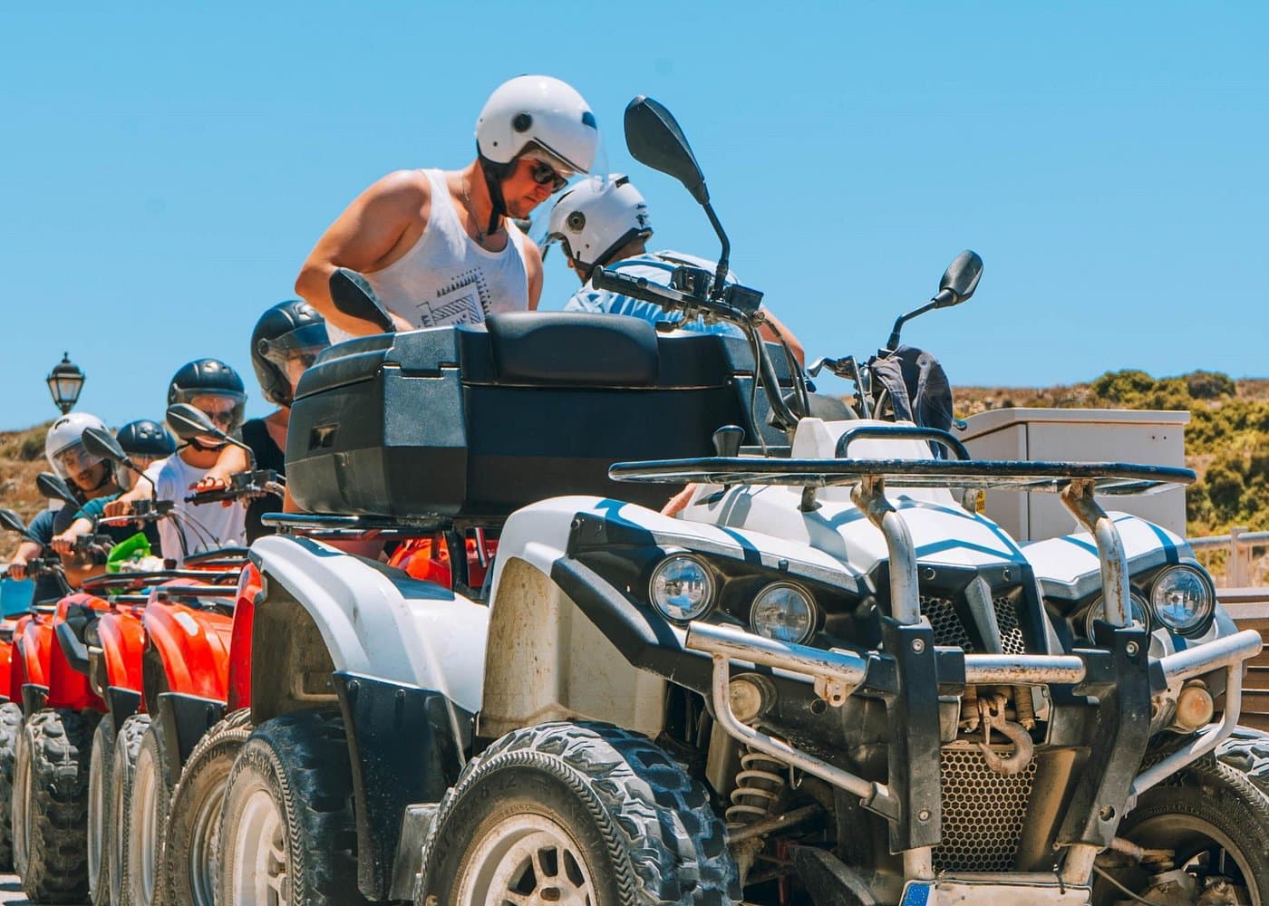Pride full-day quad convoy in Gozo with riders in helmets ready to set off.