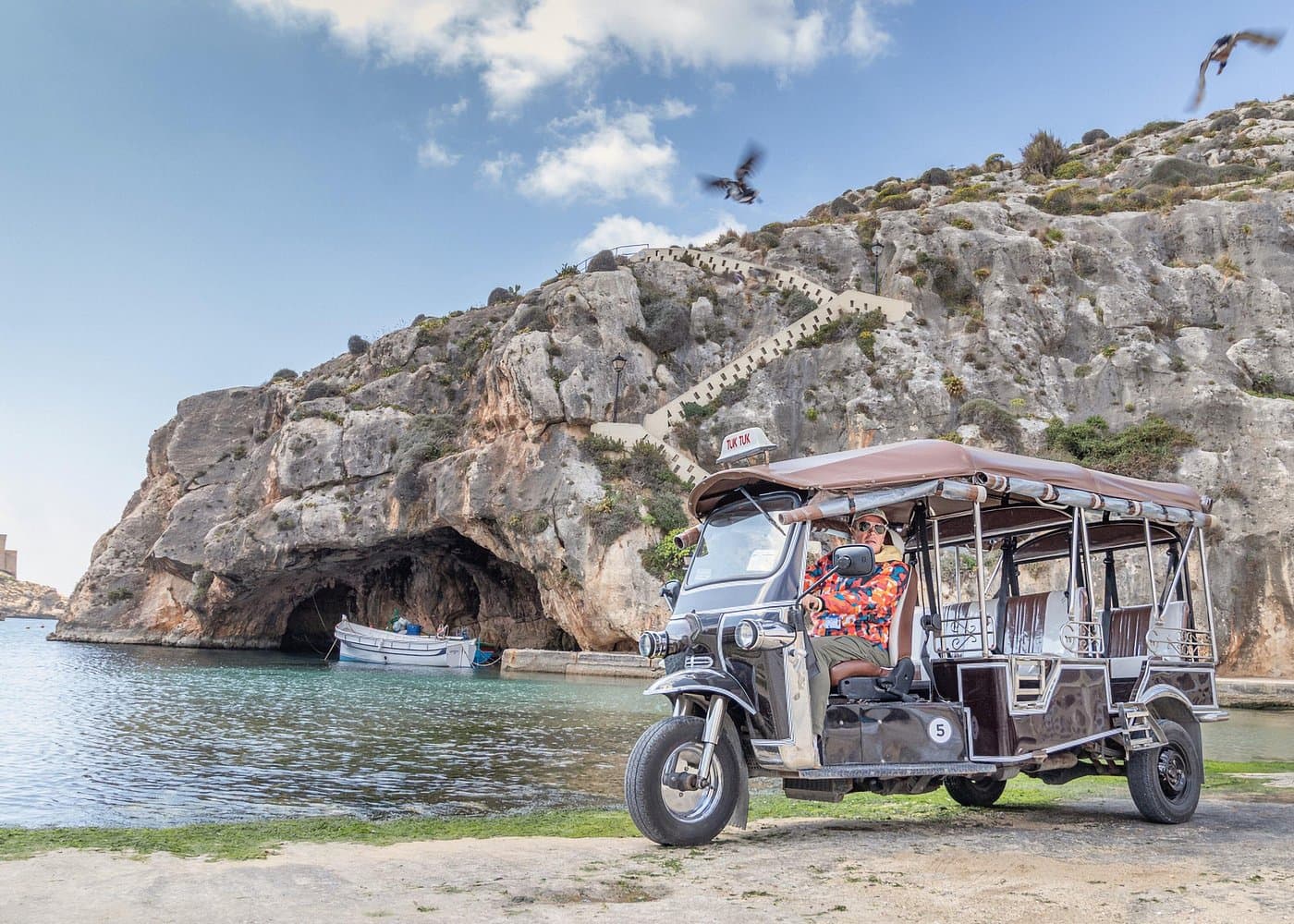 Arrigo chauffeured tuk tuk tour with a Comino mini cruise from Malta.